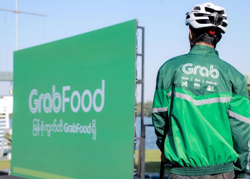说明: Grabfood通过线上下单、自行车快递的方式为顾客送餐